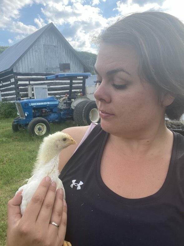 Lindsay with a chicken.