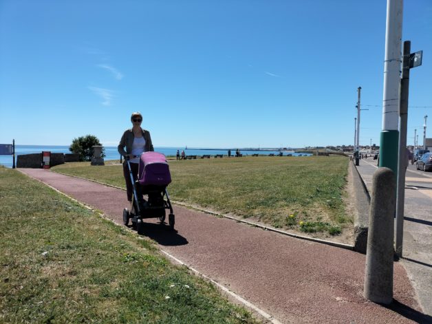 a person pushing a stroller.