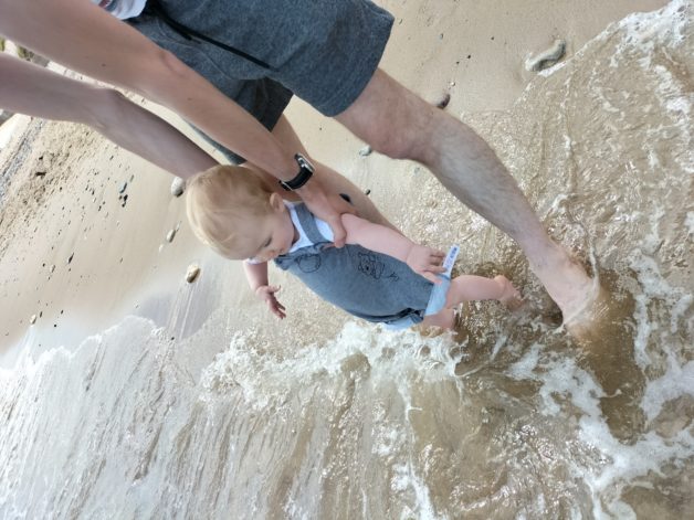 baby in the water wiht her dad.