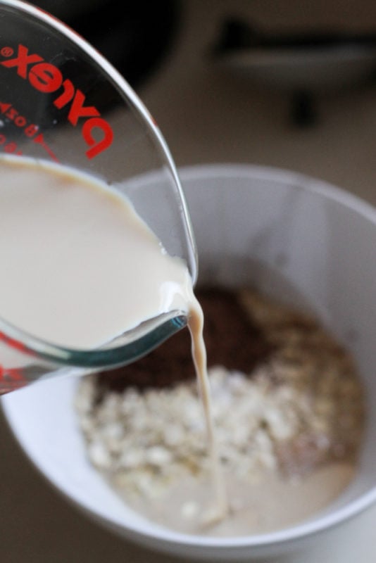 milk pouring out of a measuring cup.