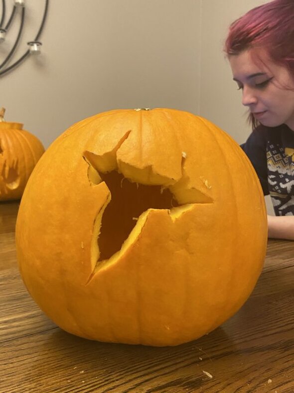 Lisey and an airplane pumpkin.