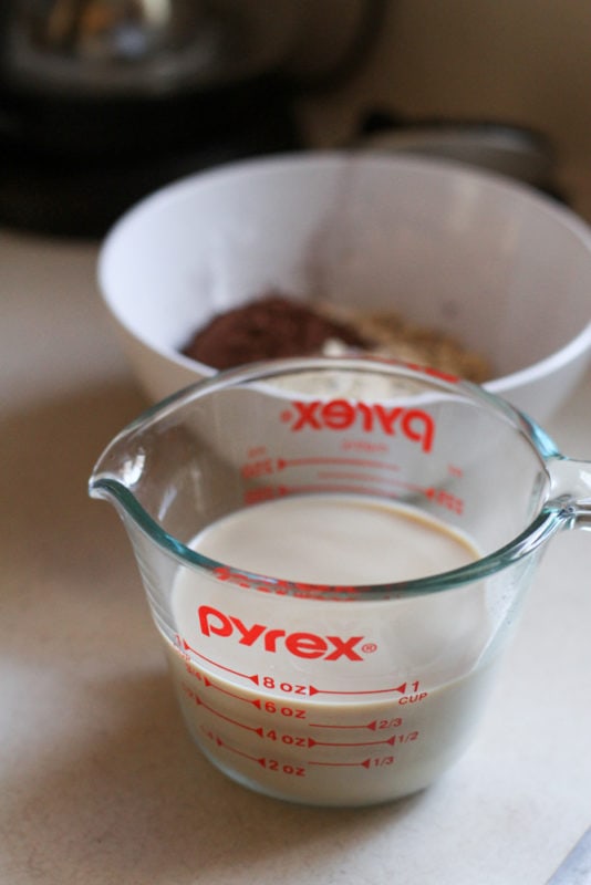 liquid for oatmeal in a measuring cup.