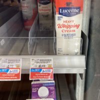 heavy cream in a grocery fridge.
