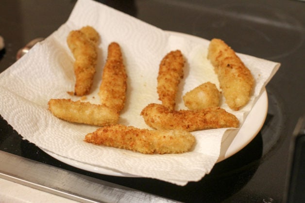 chicken fingers on a plate.