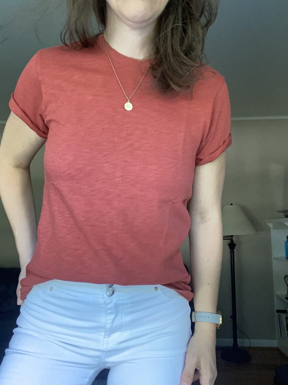 Kristen in a half-tucked tshirt.