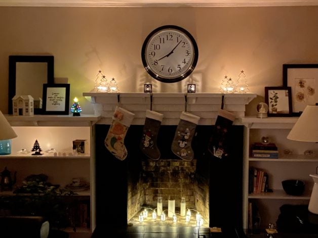 LIving room built in shelves with candles.