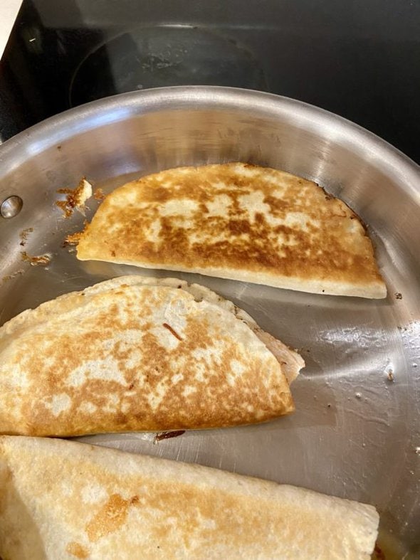 chicken quesadillas in a pan.