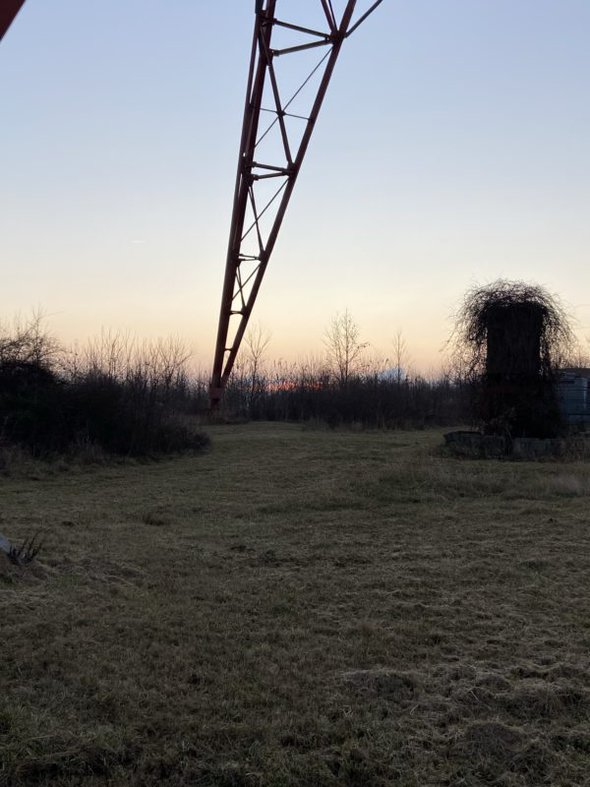 sunrise by a tower.