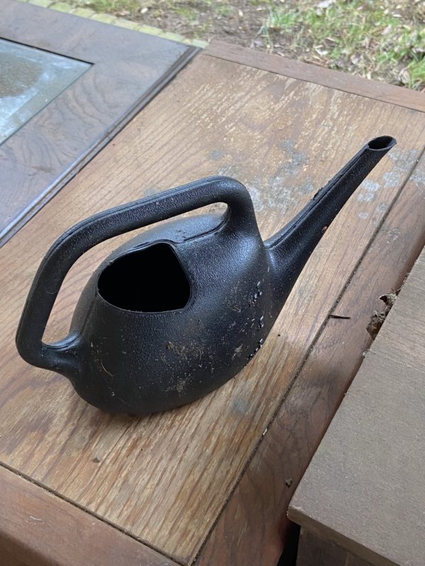 dirty watering can.