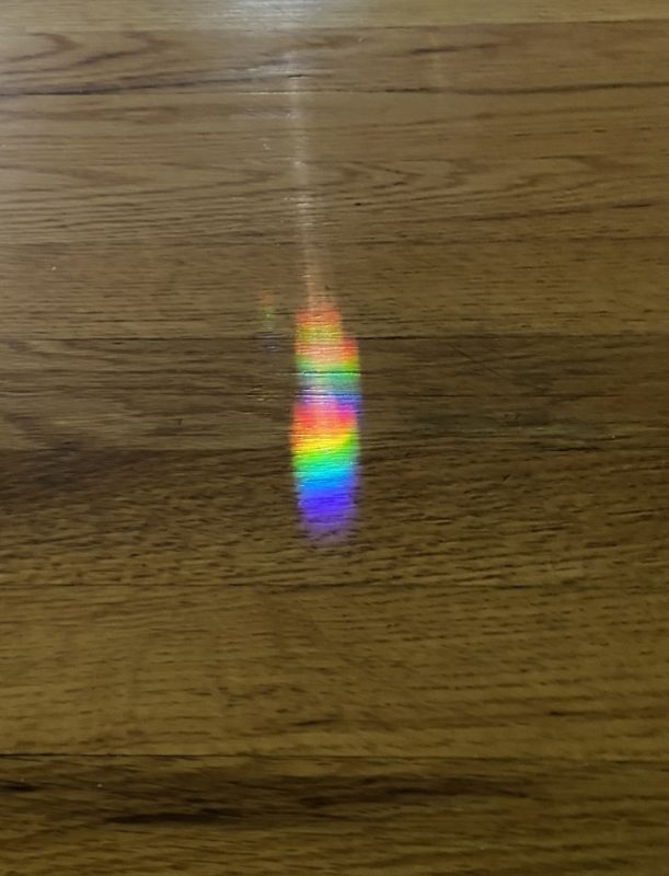 prism of rainbow colors on the floor.