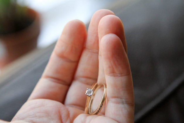 wedding rings in Kristen's hand.