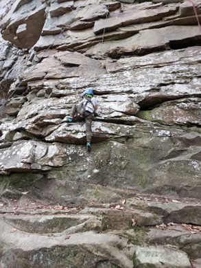 a child rock-climbing.