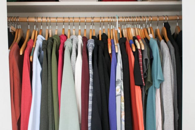 clothes hanging in a closet.