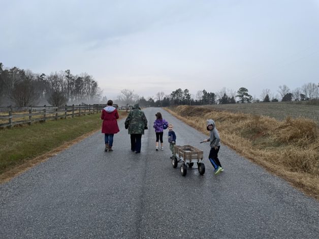 family walking on a road.