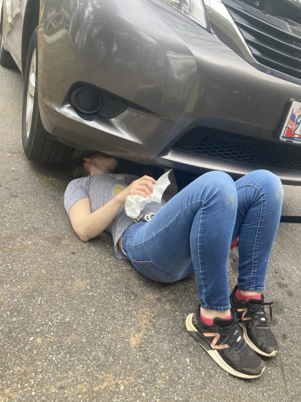 Kristen under her van.