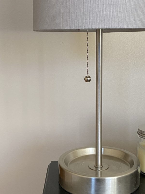 pull chain on lamp.