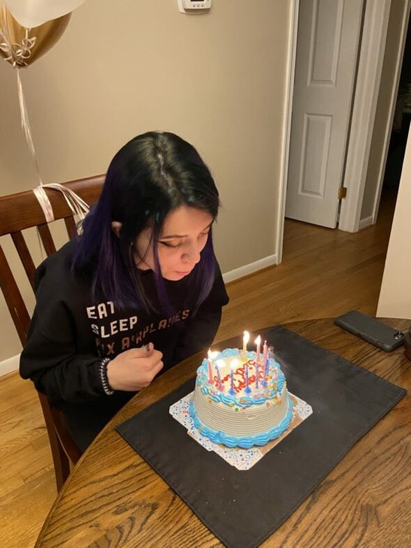 Lisey blowing out candles.