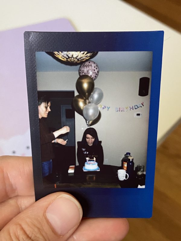 Lisey and Kristen with birthday balloons.