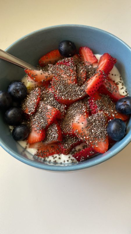 bowl of fruit, yogurt, and chia seeds.