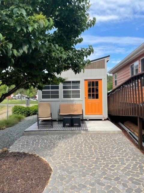 shed with orange door.