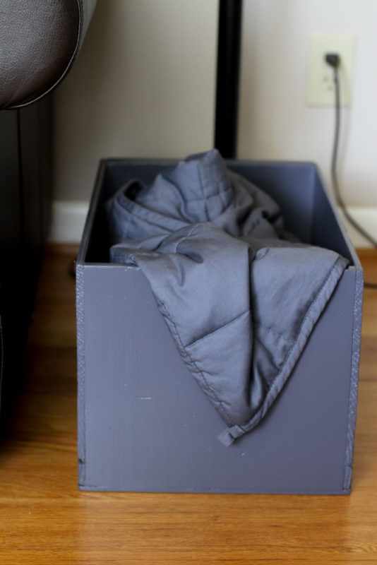 crate holding a blanket.