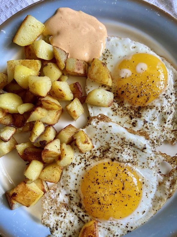 fried eggs and potatoes.