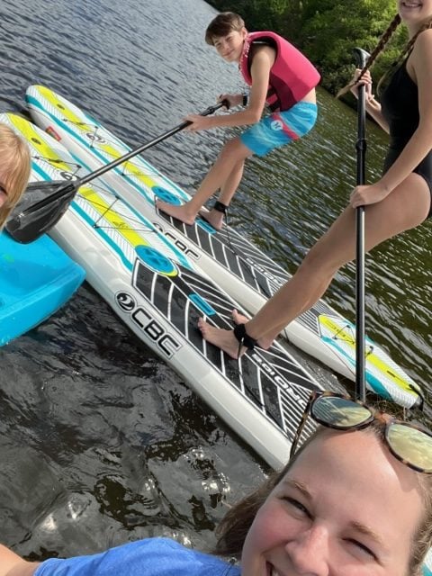 kids on stand up paddleboards.