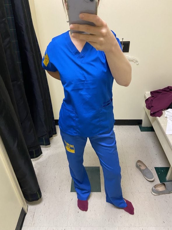 Kristen in scrubs.