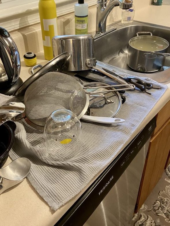 dishes drying on a towel.