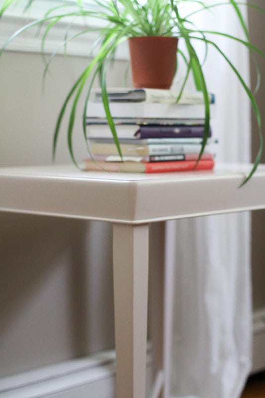 table stacked with books.