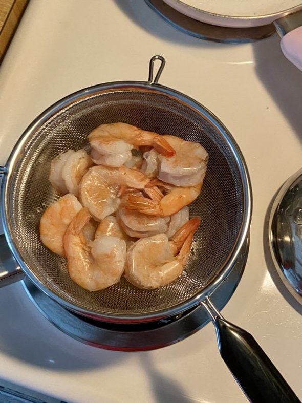 shrimp in strainer.