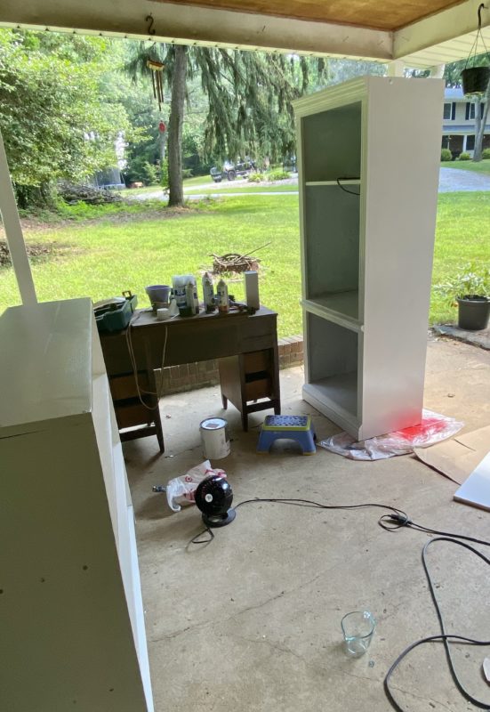 bookshelf in a carport.