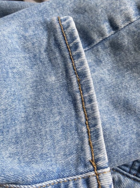 mended jeans seam.