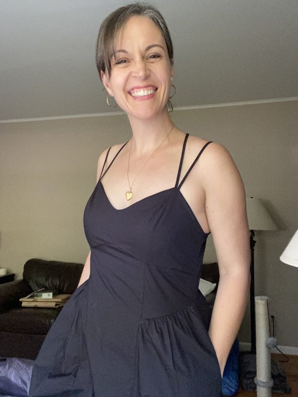 Kristen in a black dress.