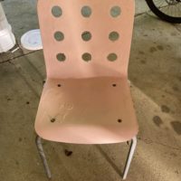 damaged pink chair.