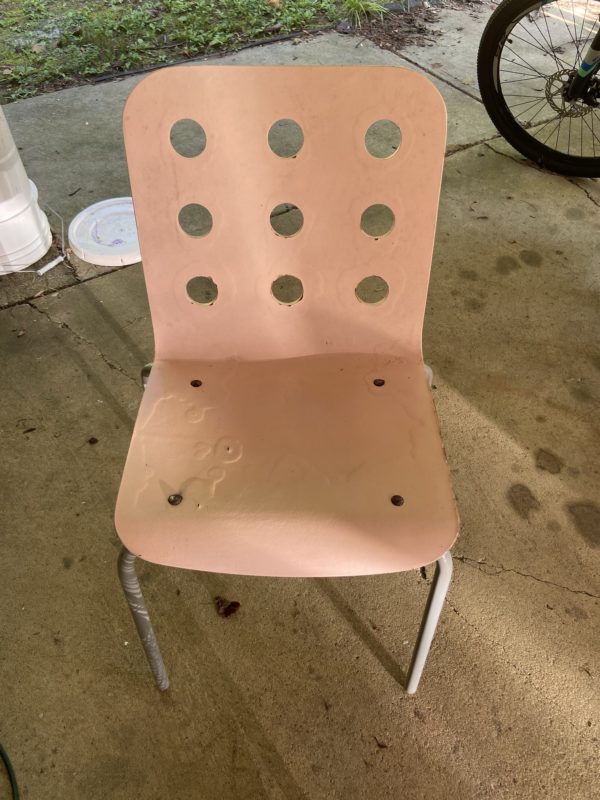 damaged pink chair.