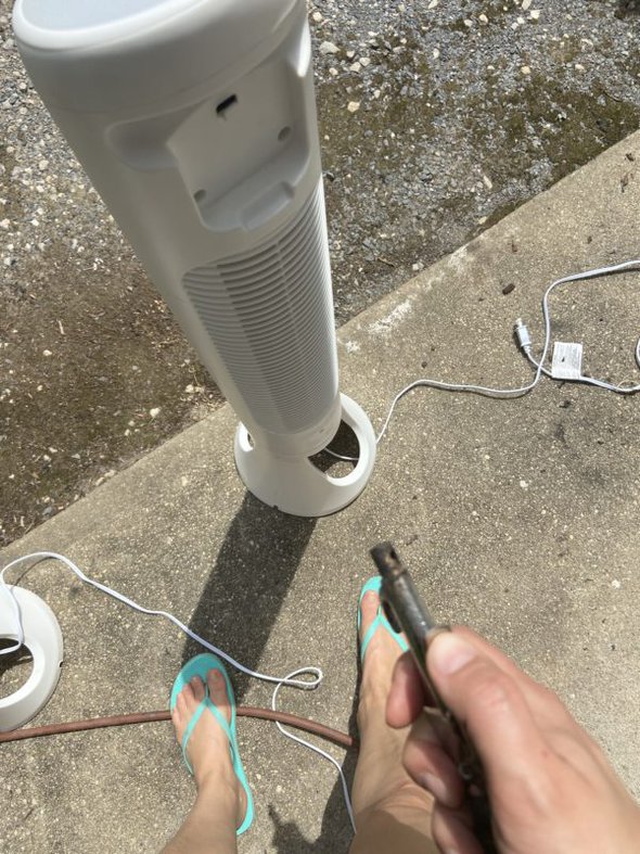 air compressor pointed at fan.