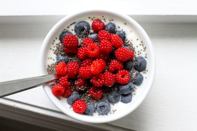 yogurt topped with berries.