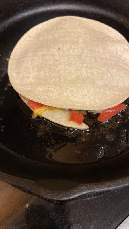 quesadilla in frying pan.