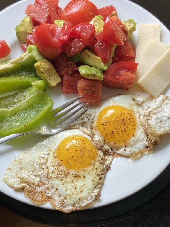 eggs and vegetables on a white plate.