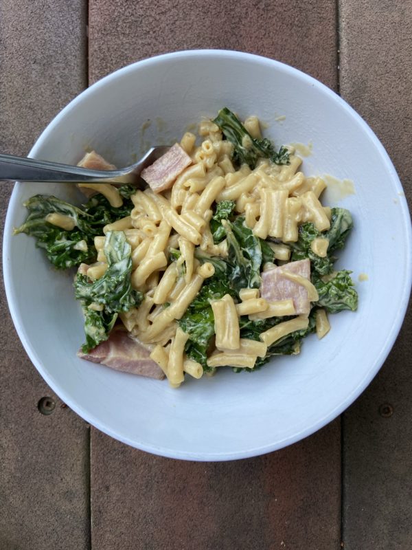 ham and kale and mac and cheese in a bowl.