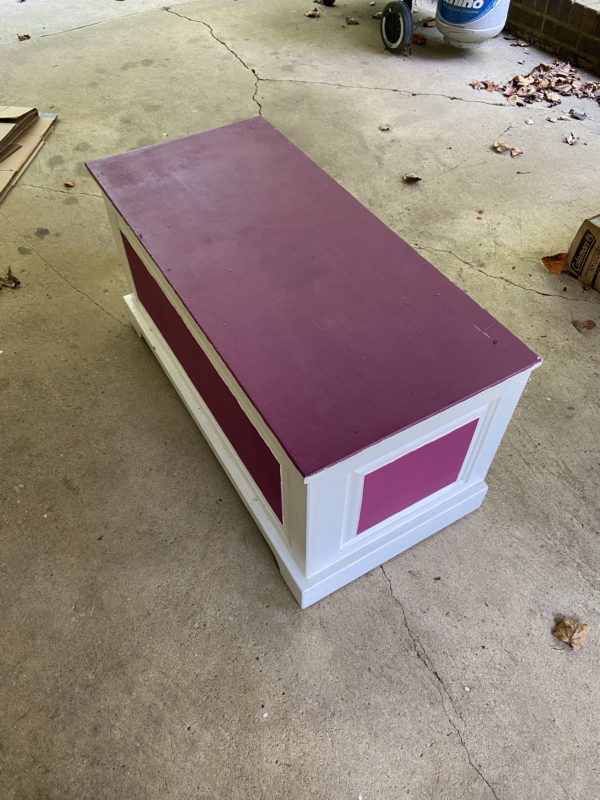 pink and white wooden chest.