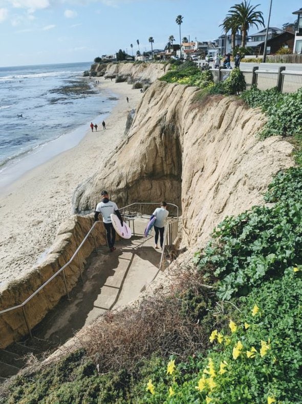 two boys with surfboards.