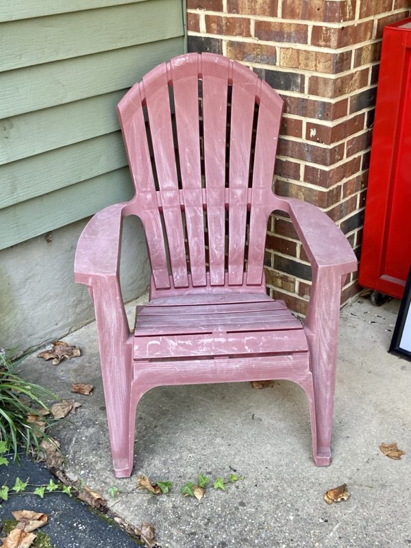 red plastic adirondack chair.