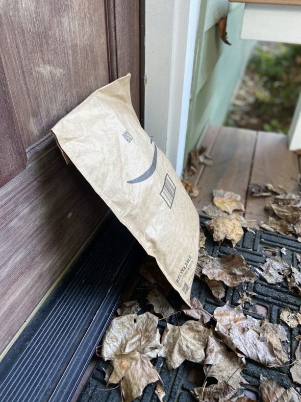 amazon package leaning against door.