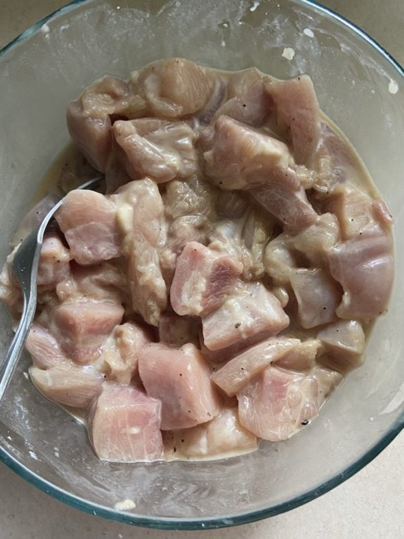 coated raw chicken.