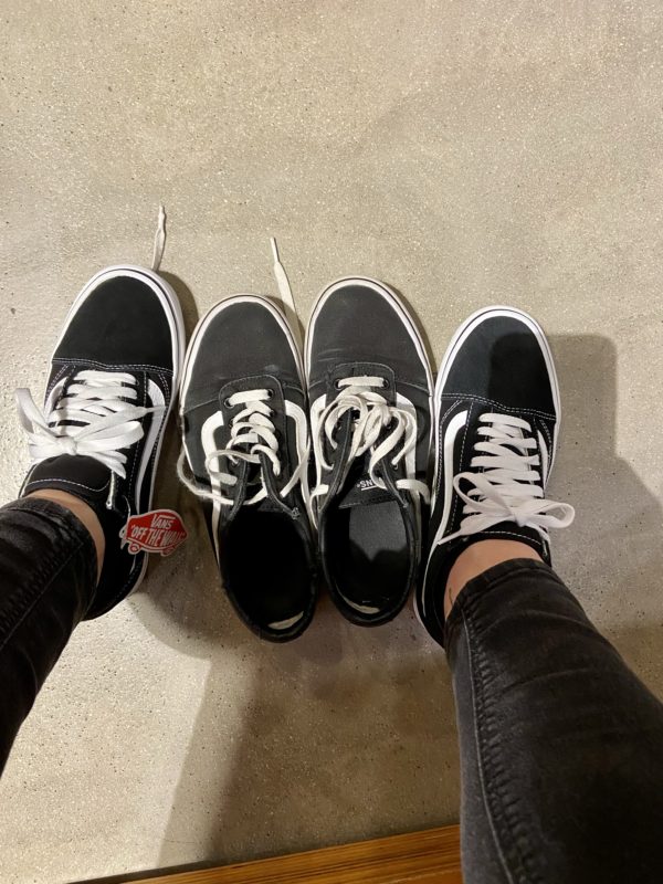 two pairs of black Vans.