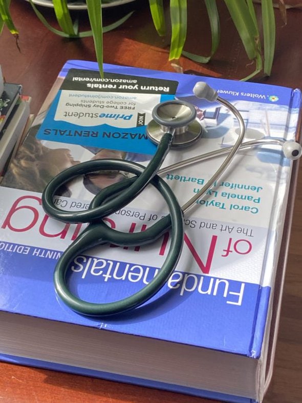 stethoscope on textbook.