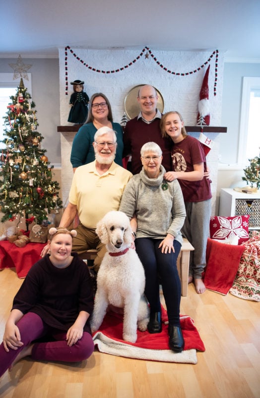 Family picture with parents and their dog, Finn.