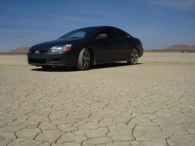 car on dry desert ground.
